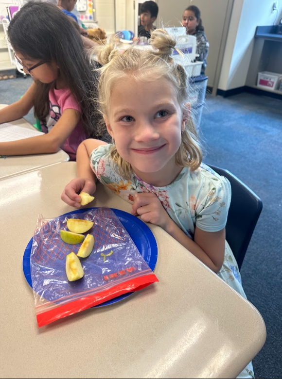 2nd grade students doing apple math