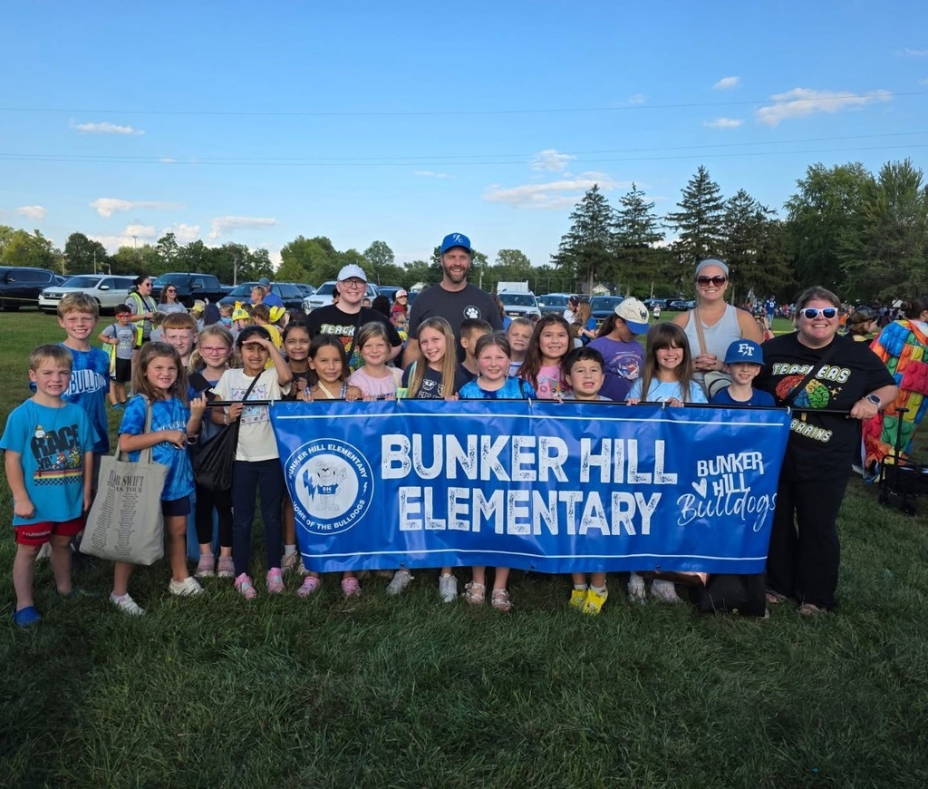 Students and staff holding a Bunker Hill Elementary Sign