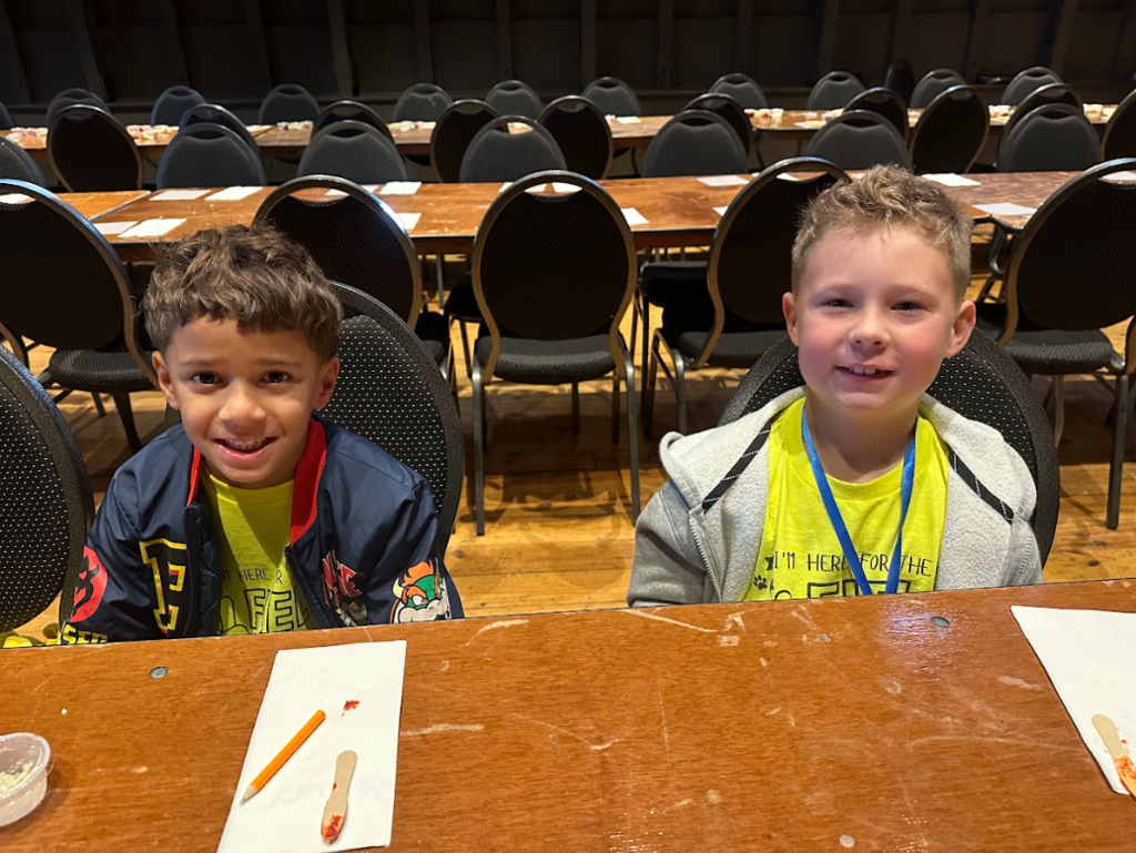 students smiling at table
