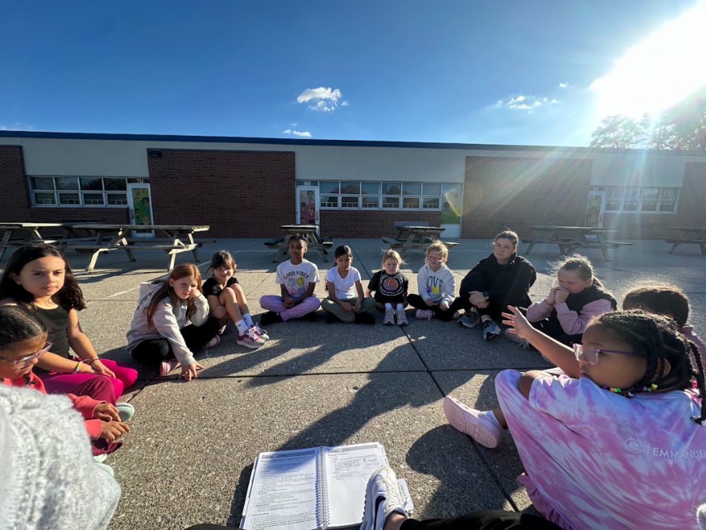 Group of girls sitting together in a circle