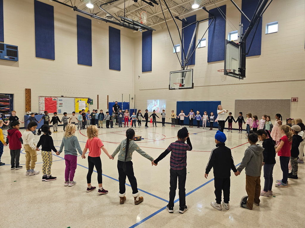 Students holding hands in a circle