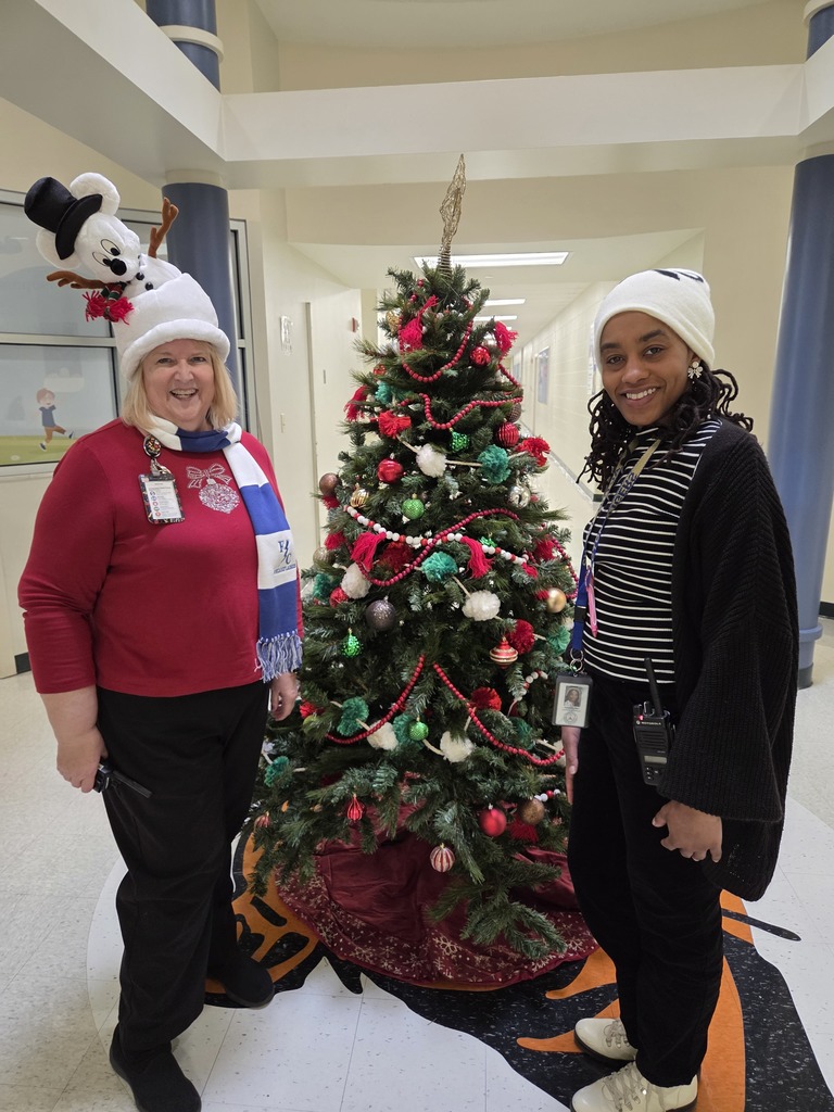 Holiday Hair Don't Care. Staff wears their festive hats