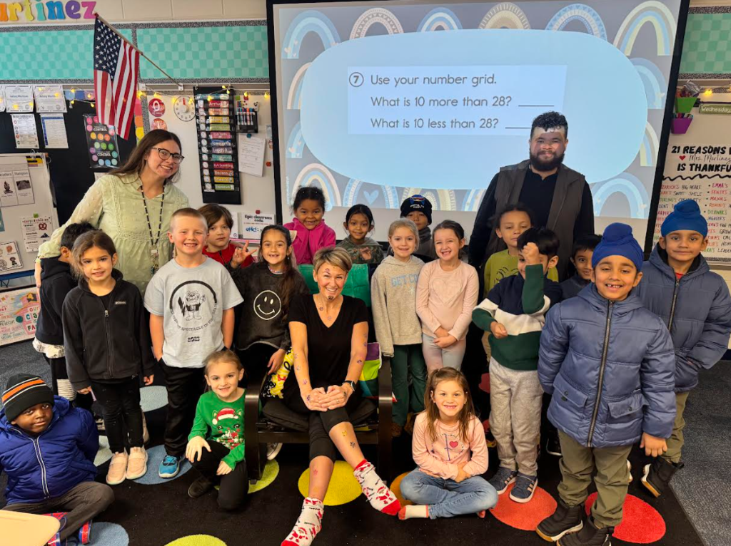 Students smiling with their principal