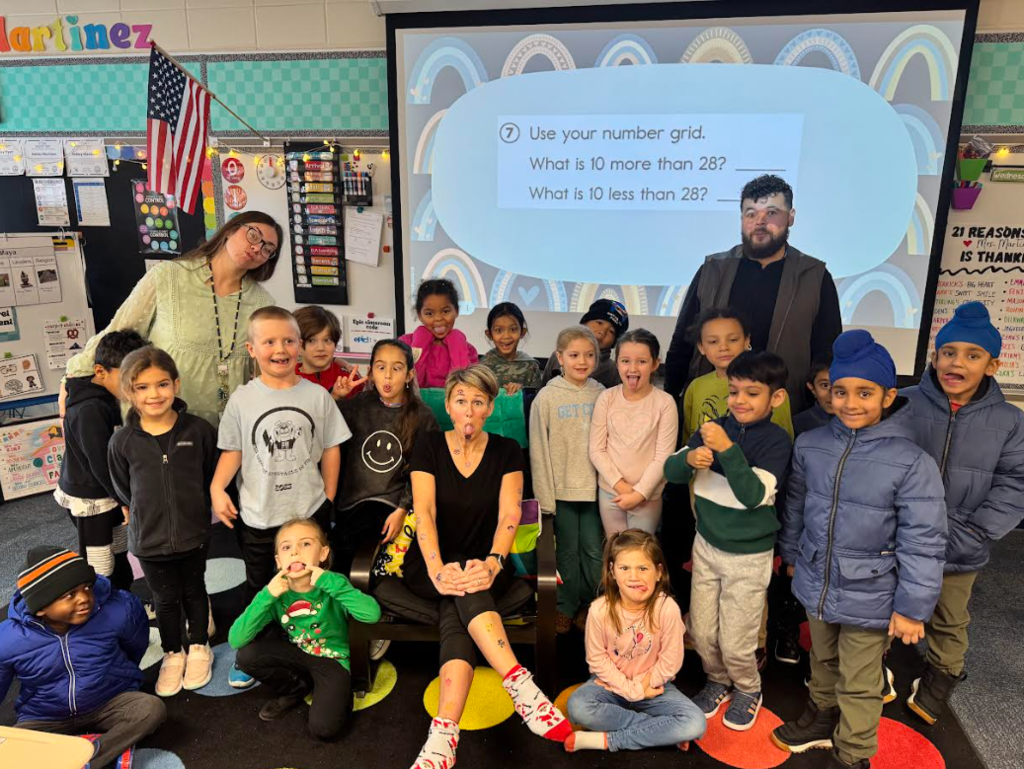 Students smiling with their principal