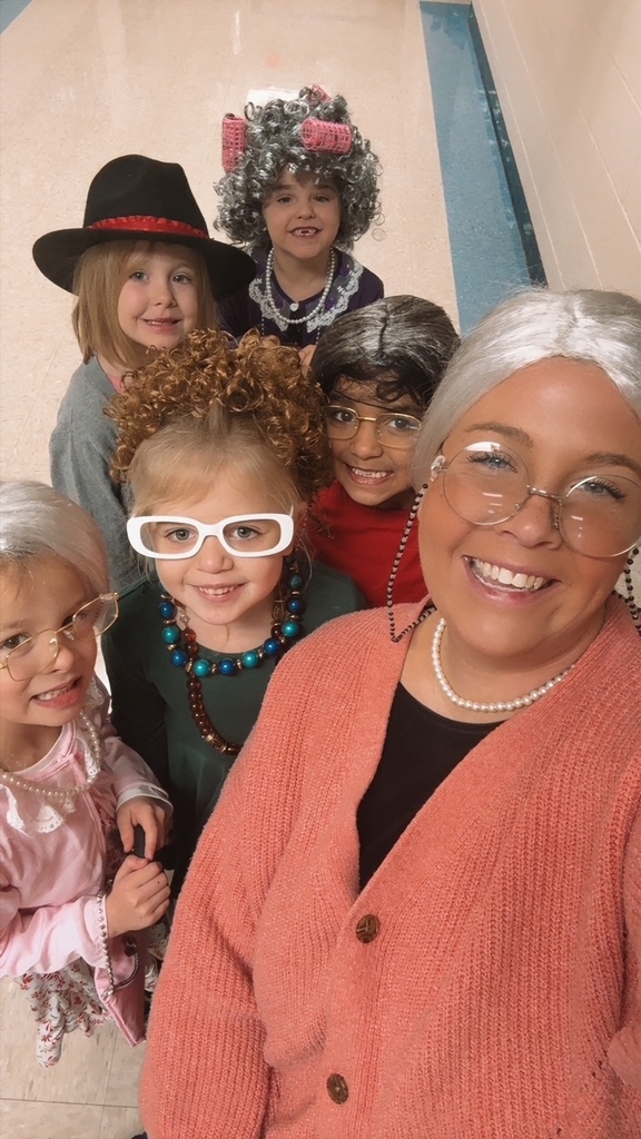 Mini Merks smiling for the 100th day of school