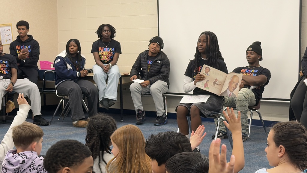 high school students reading to third grade
