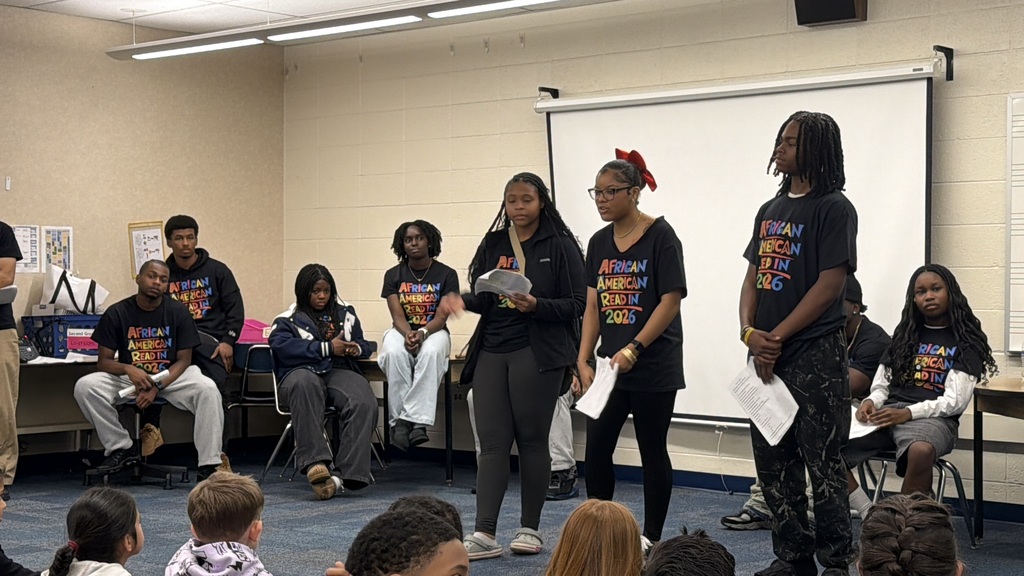 high school students reading to third grade
