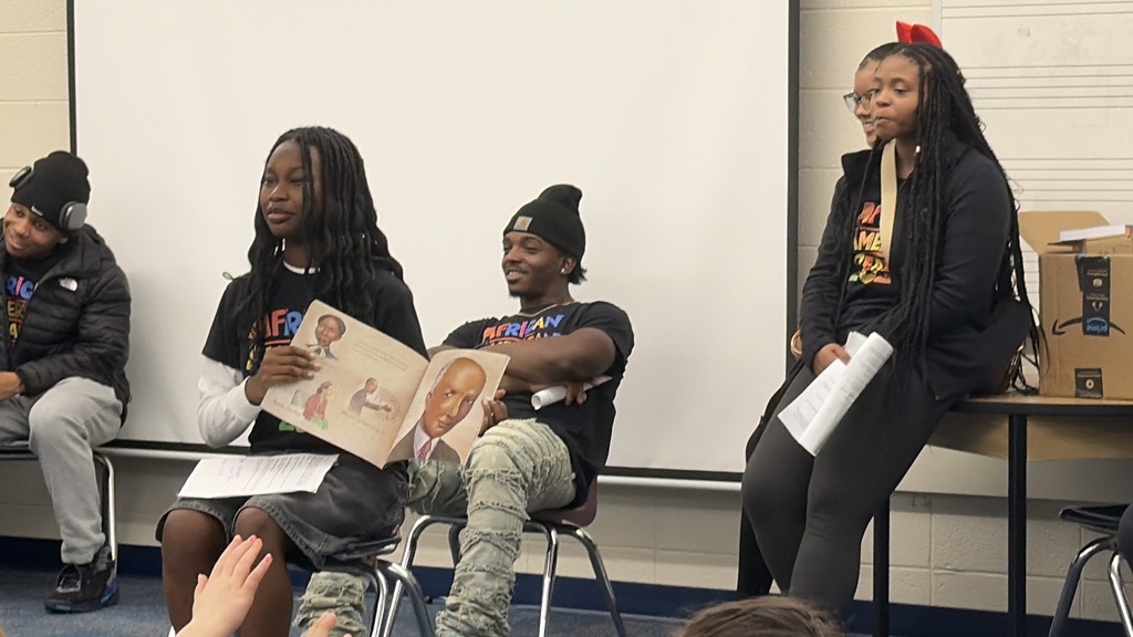 high school students reading to third grade