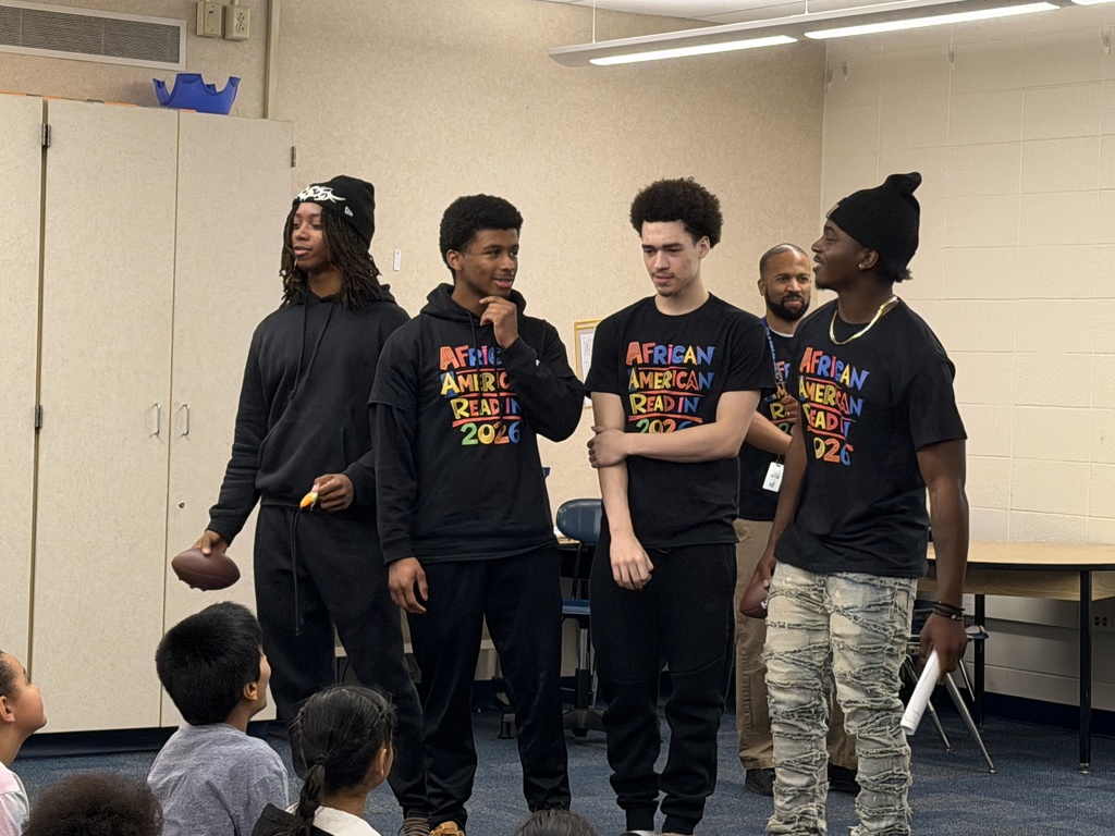 high school students reading to third grade