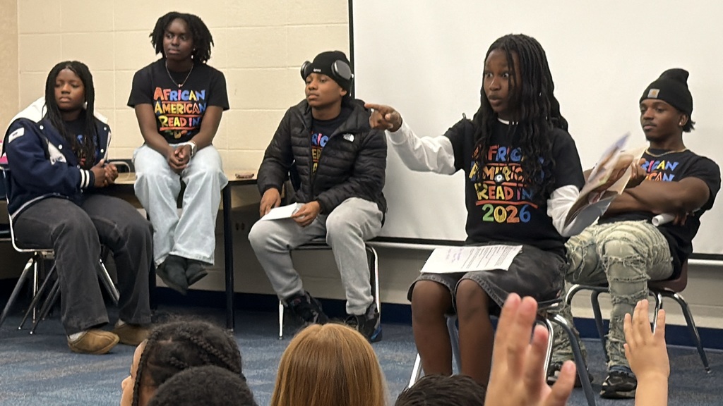 high school students reading to third grade