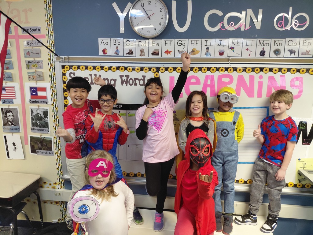 second graders dressed like super heroes for read across america week