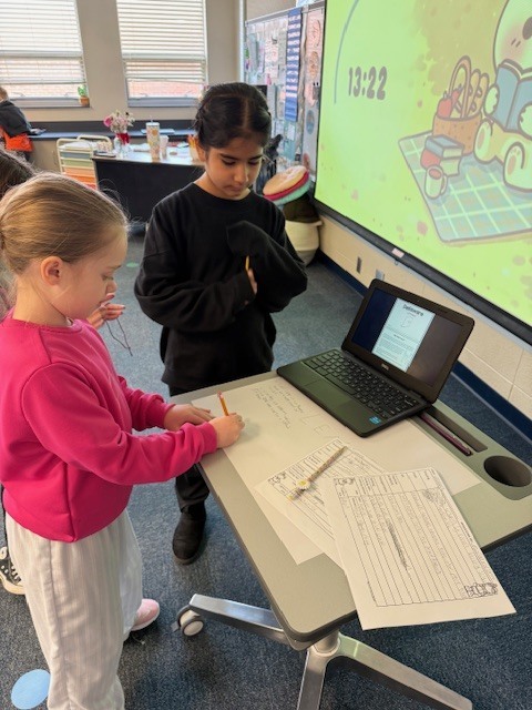 Mrs. Hoffman's 3rd grade students doing research