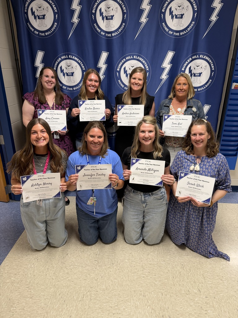 Teacher  of the Year nominees smiling together holding certificates