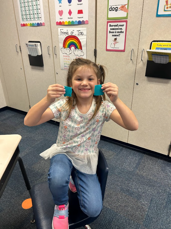 first grade students using play-doh to work on the concept of halves