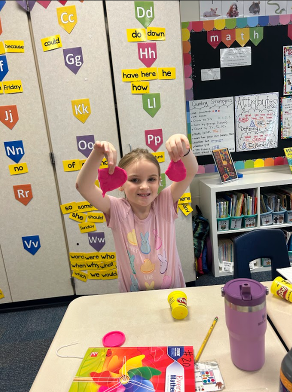 first grade students using play-doh to work on the concept of halves