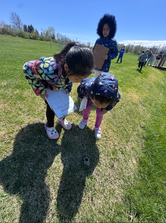 Mrs. Gorske's kindergarten students outside exploring signs of spring