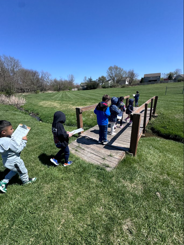 Mrs. Gorske's kindergarten students outside exploring signs of spring