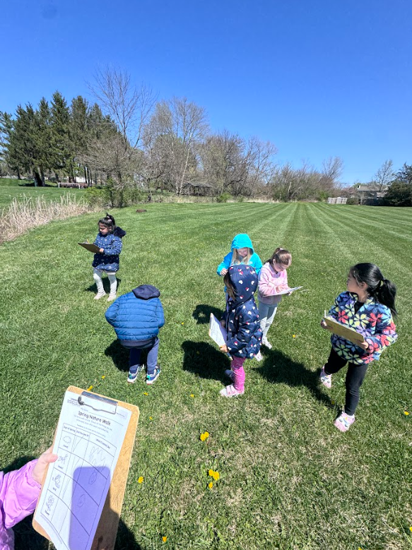 Mrs. Gorske's kindergarten students outside exploring signs of spring