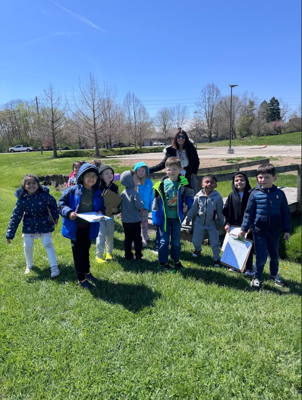 Mrs. Gorske's kindergarten students outside exploring signs of spring