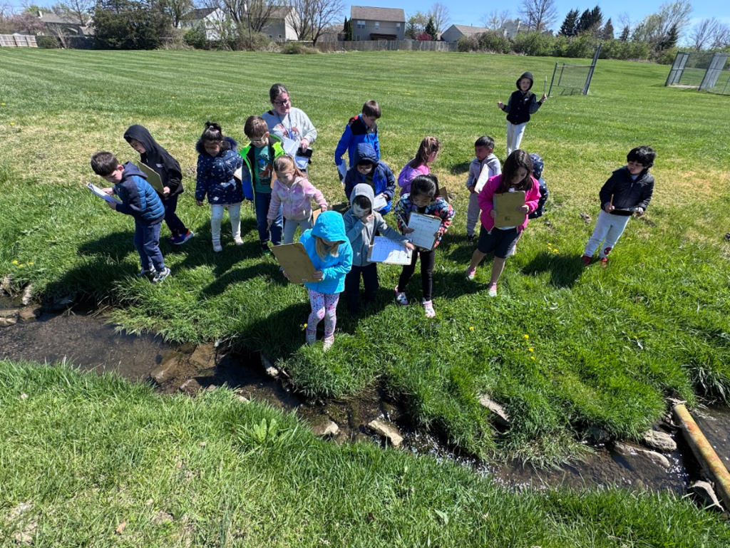 Mrs. Gorske's kindergarten students outside exploring signs of spring