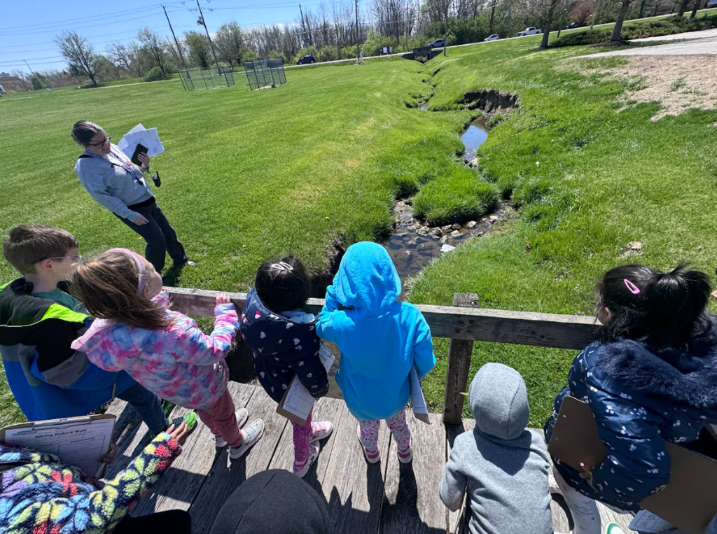 Mrs. Gorske's kindergarten students outside exploring signs of spring