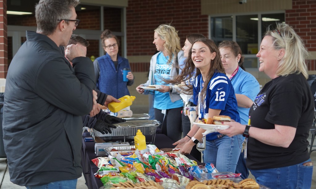 staff laughing together at Edgewood staff cookout