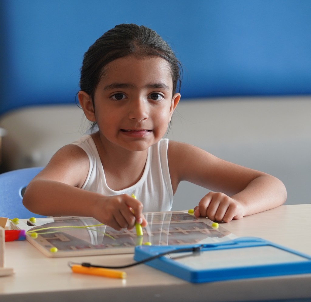 Smiling Kindergarten Student