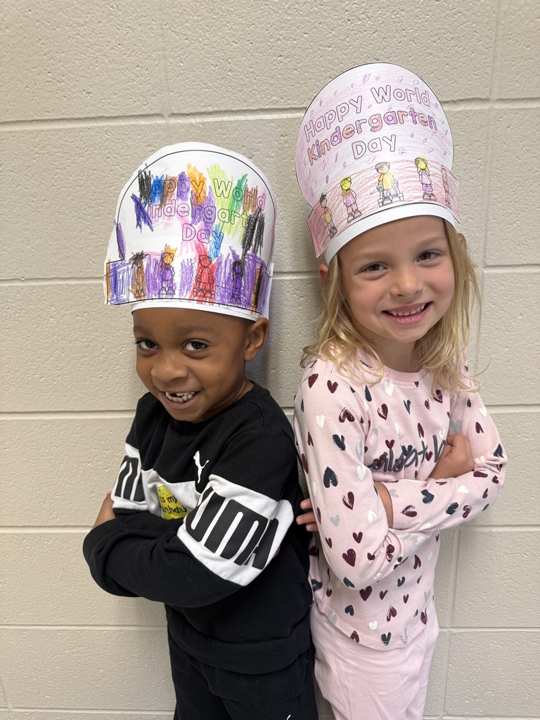 Kindergarten students wearing hats that they decorated for World Kindergarten Day