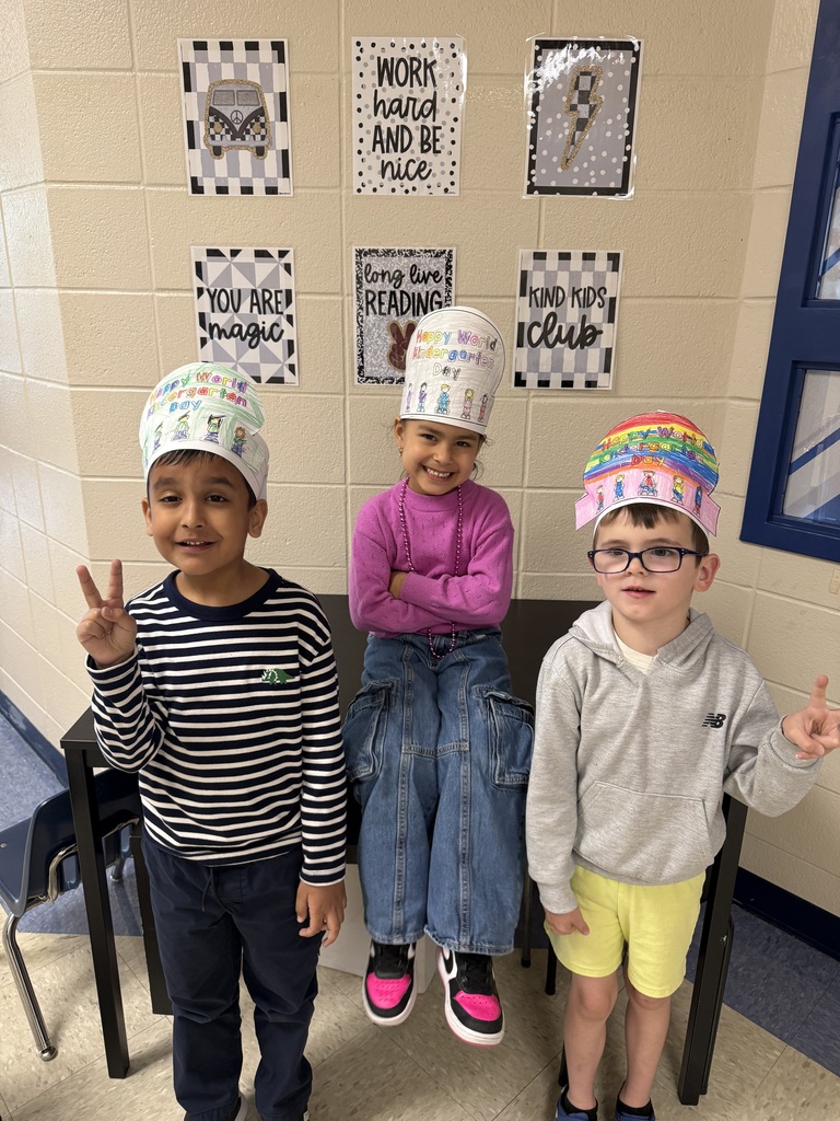 Kindergarten students wearing hats that they decorated for World Kindergarten Day