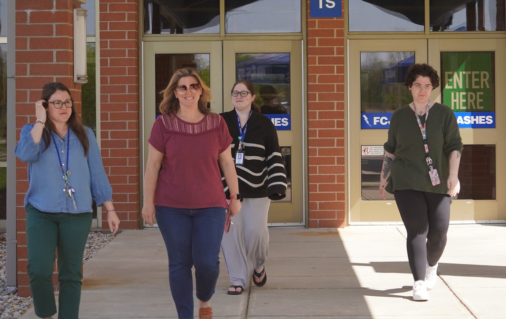 staff walking out of the junior high school