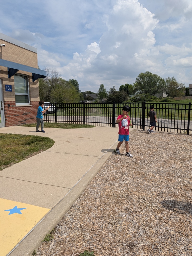 student blowing bubbles on B for Bubbles day