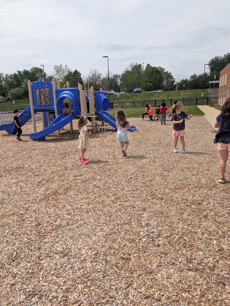 student blowing bubbles on B for Bubbles day