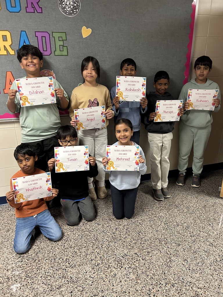 students holding certificates for improved WIDA scores