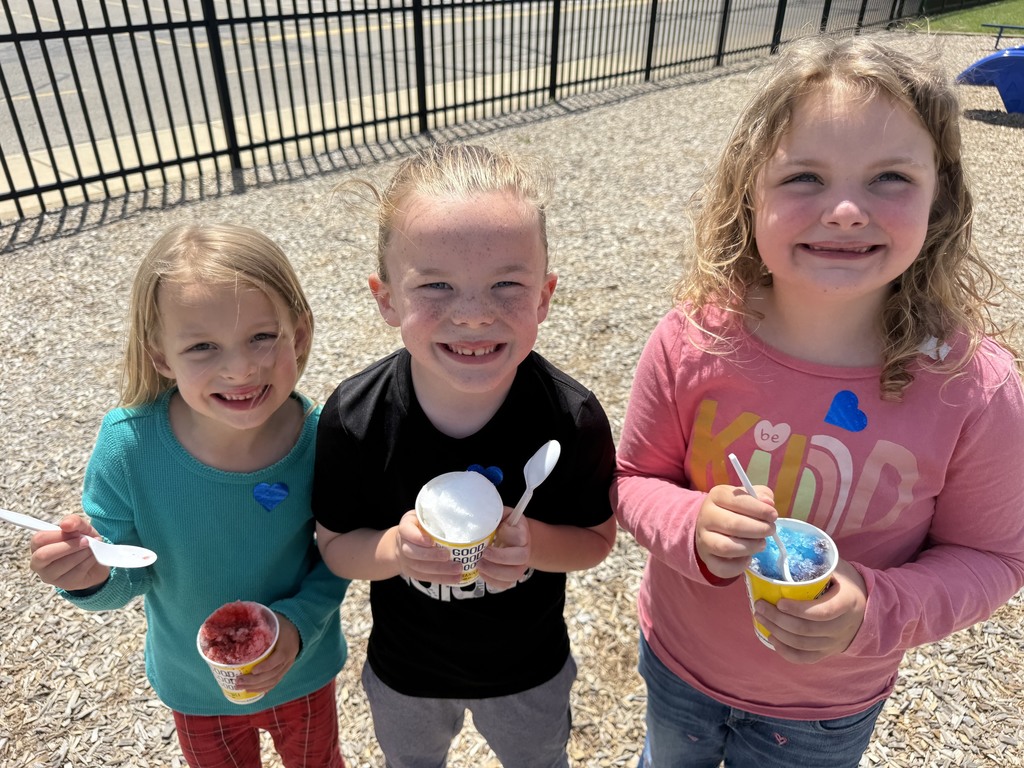 kindergarten in the grass eating kona shaved ice