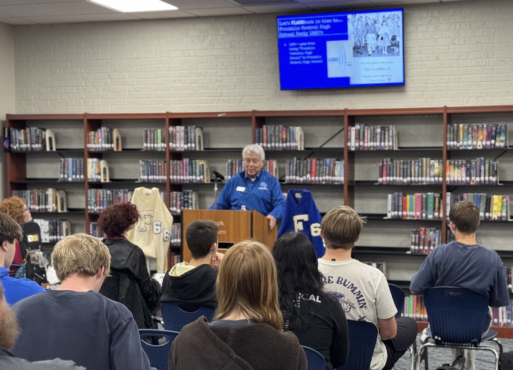 Larry Walker talking with students