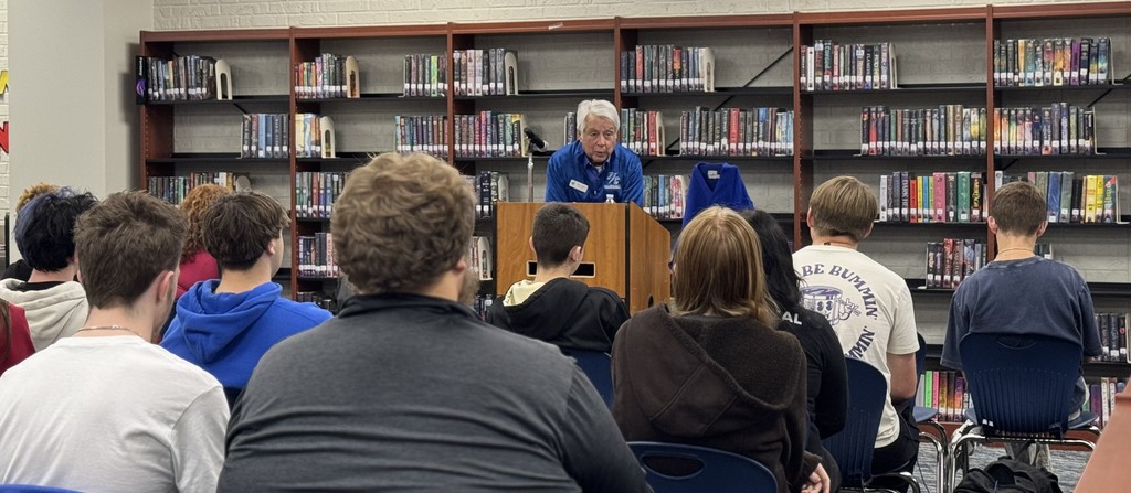 Larry Walker talking with students