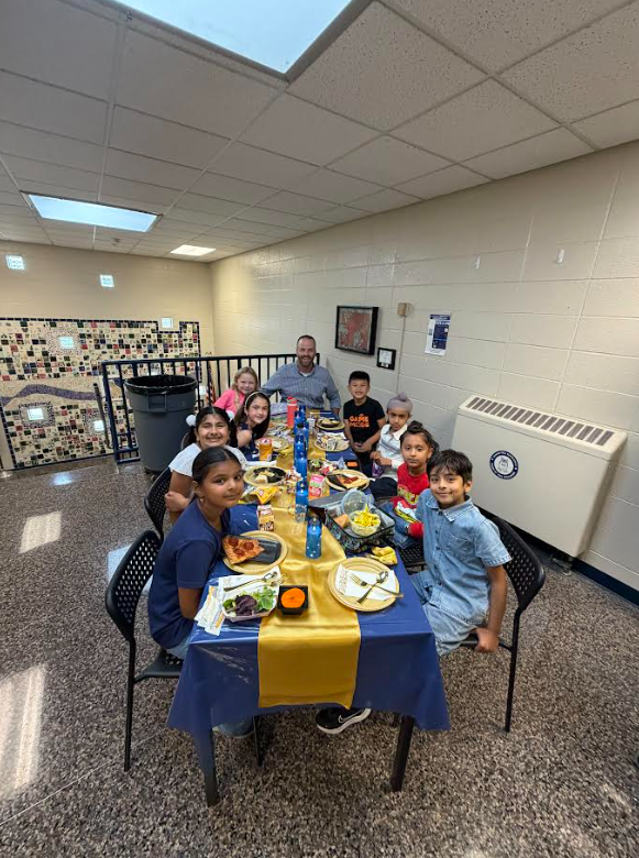 Lunch at the Ritz - students smiling with an administrator