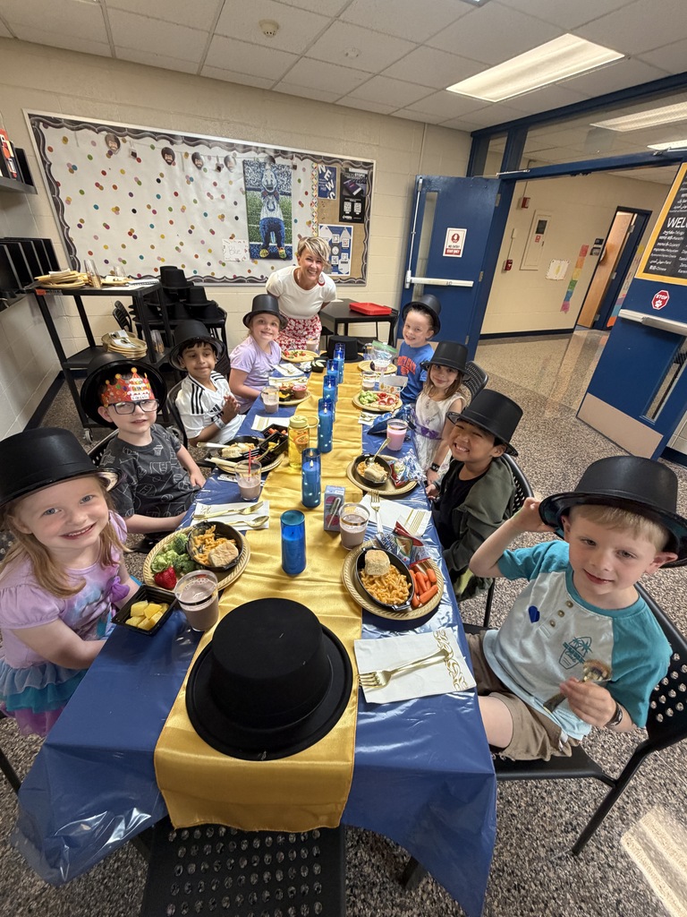 Lunch at the Ritz - students smiling with an administrator