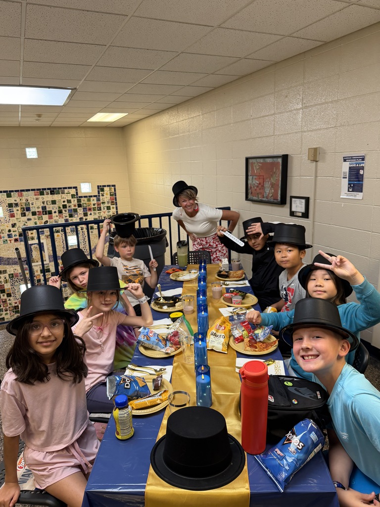 Lunch at the Ritz - students smiling with an administrator