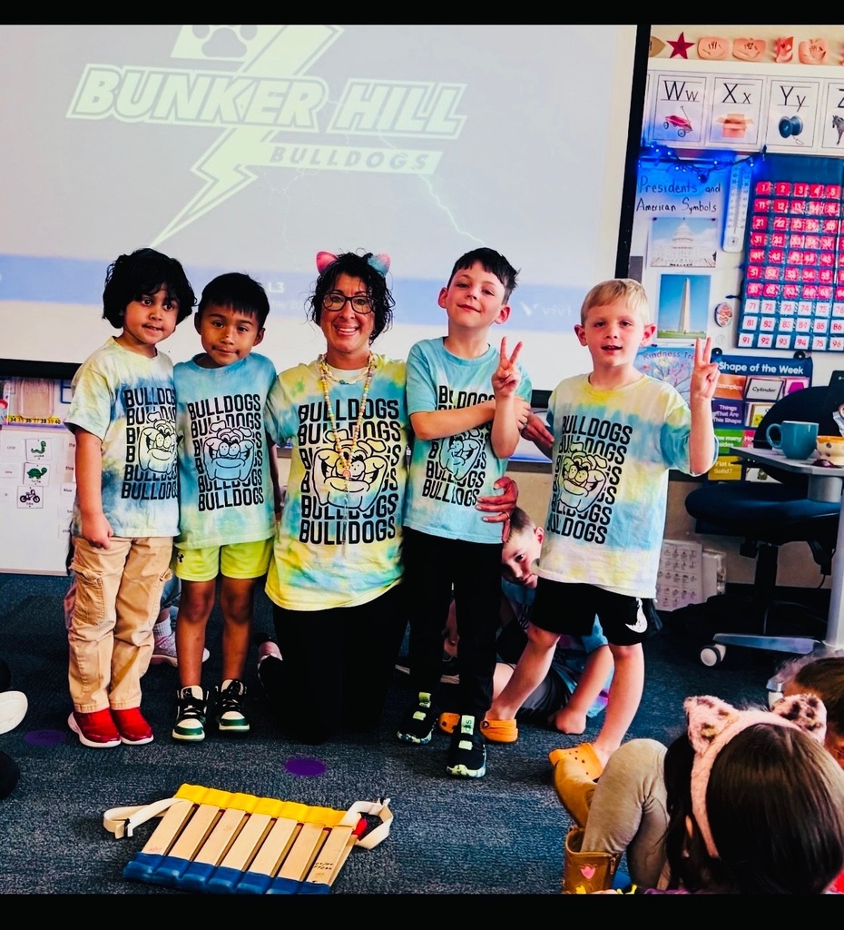Mrs. Gorske's kindergarten class smiling together in tye dye shirts for T day