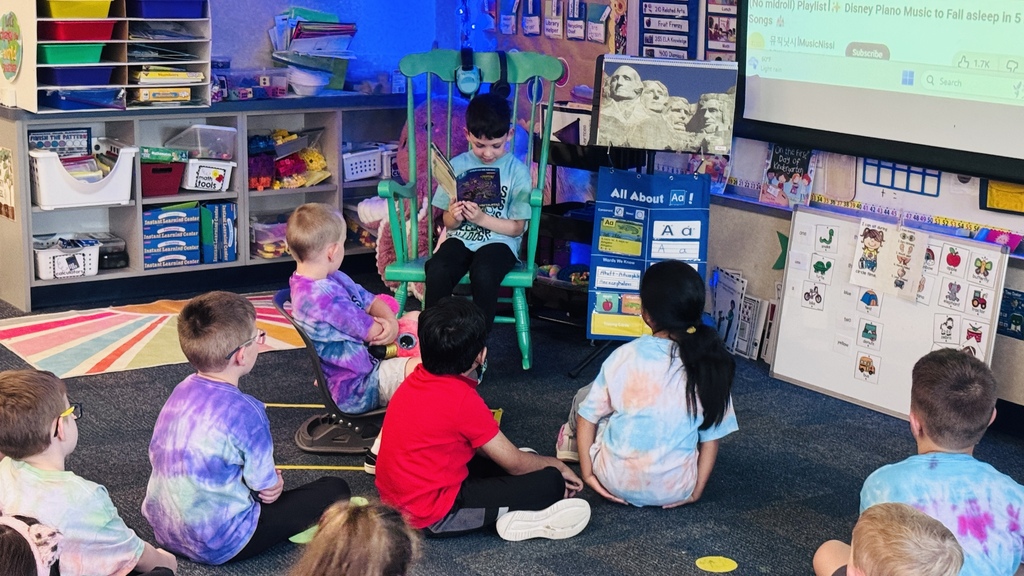 Mrs. Gorske's kindergarten class smiling together in tye dye shirts for T day