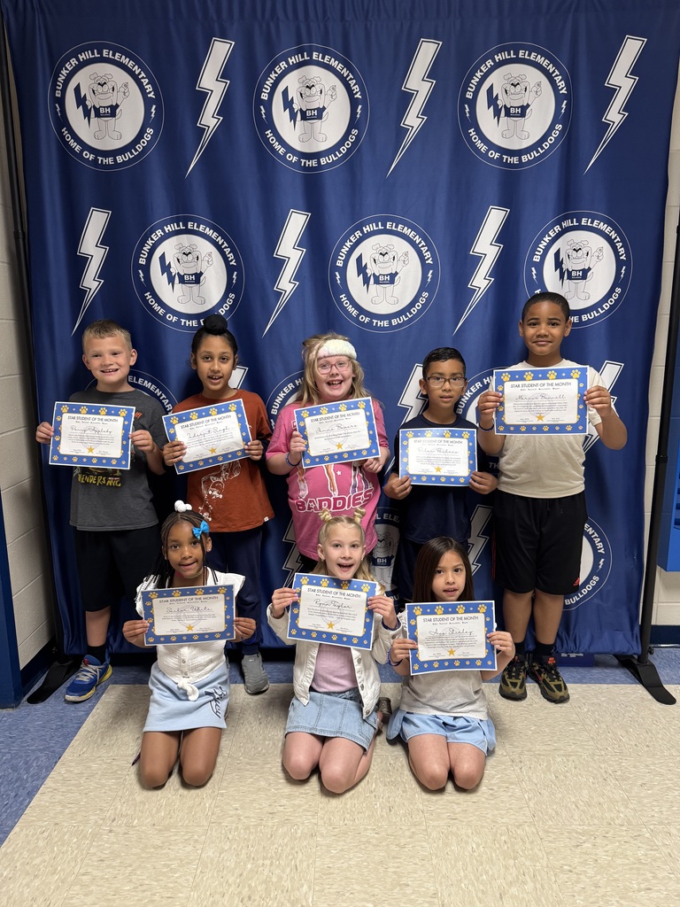 STAR students holding certificates smiling