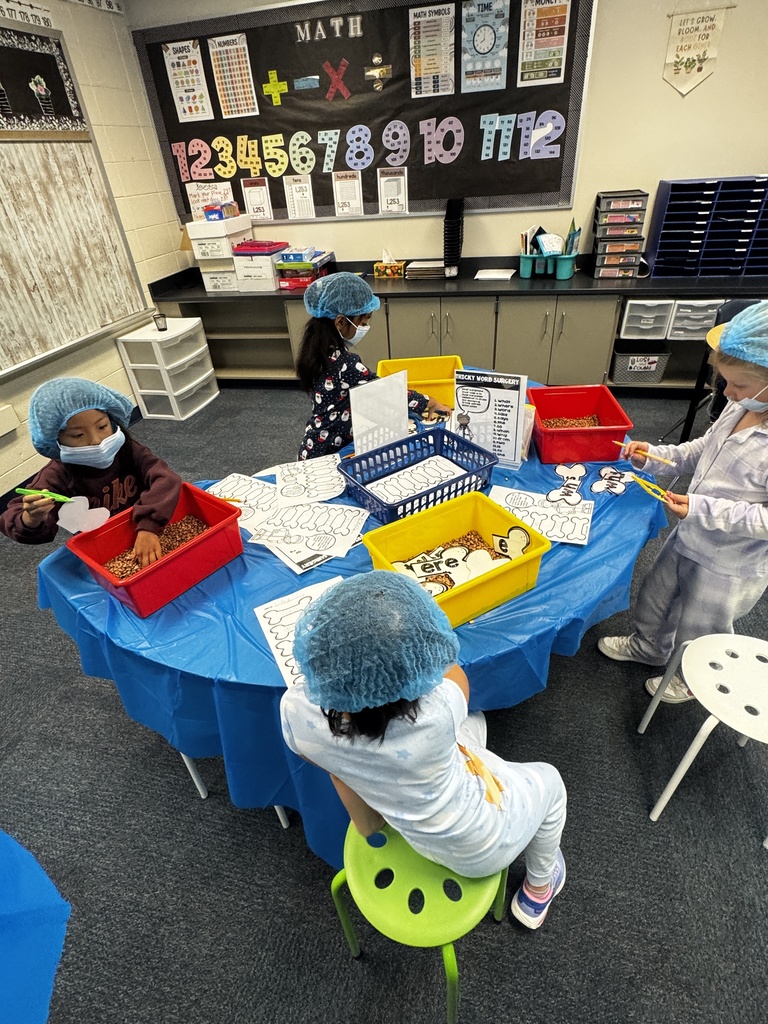 first grade OR day where students are wearing scrubs and doing body themed activities