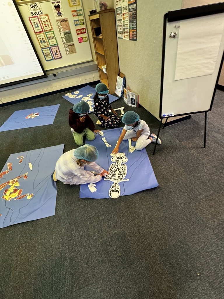 first grade OR day where students are wearing scrubs and doing body themed activities