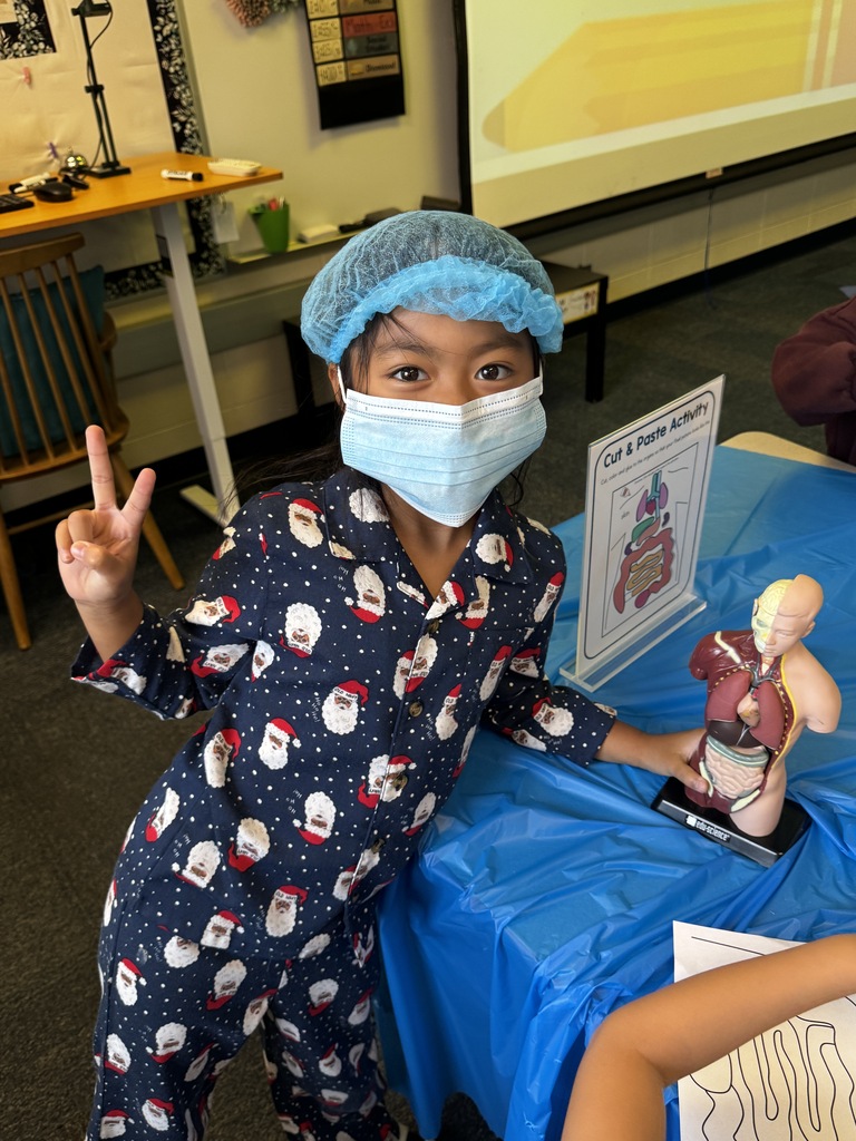 first grade OR day where students are wearing scrubs and doing body themed activities