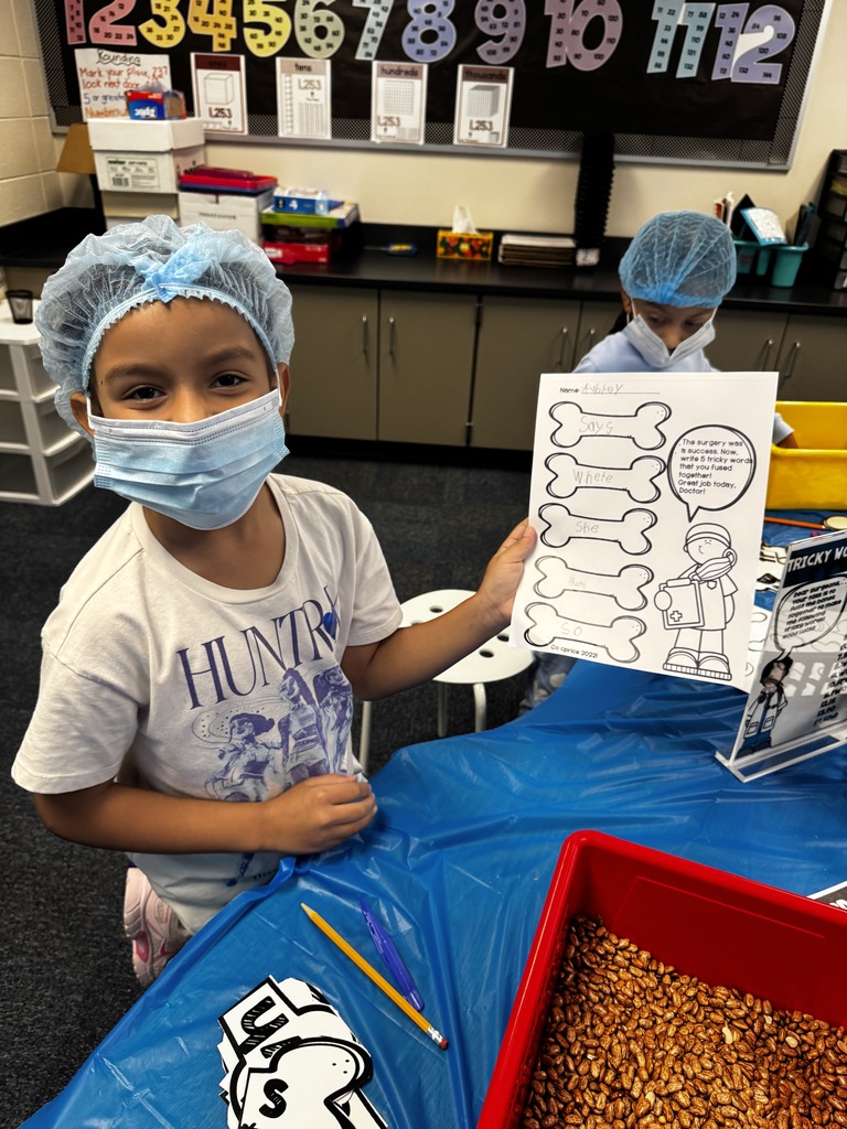 first grade OR day where students are wearing scrubs and doing body themed activities
