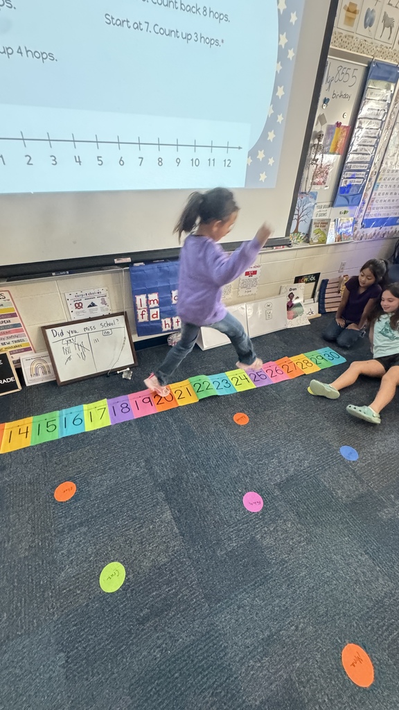 student jumping on number line