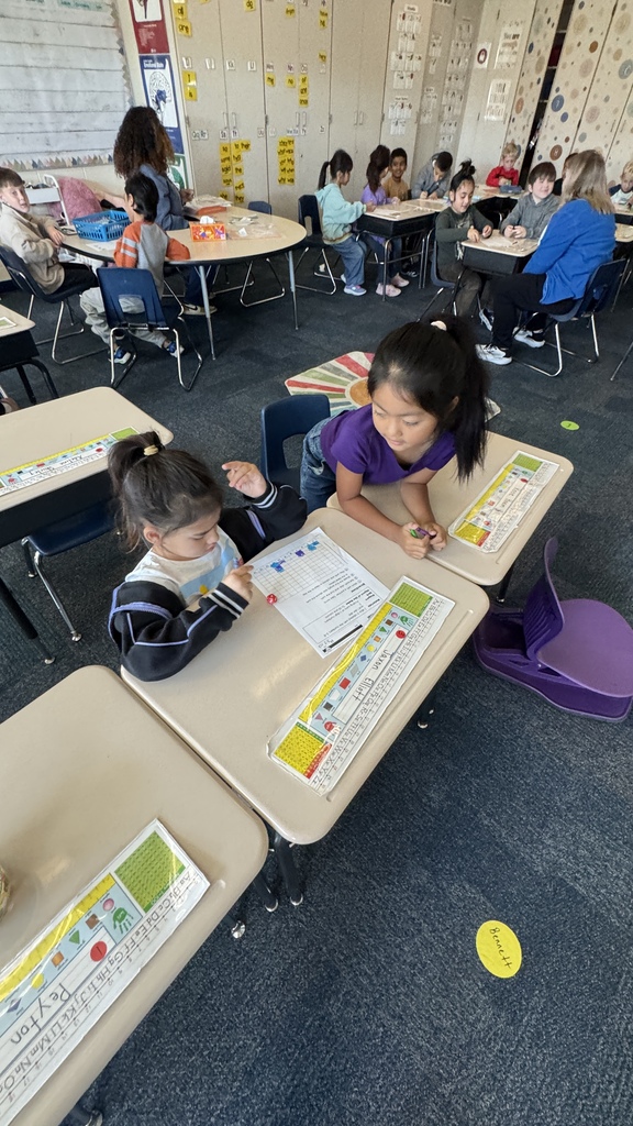 students working together on addition graphing worksheet