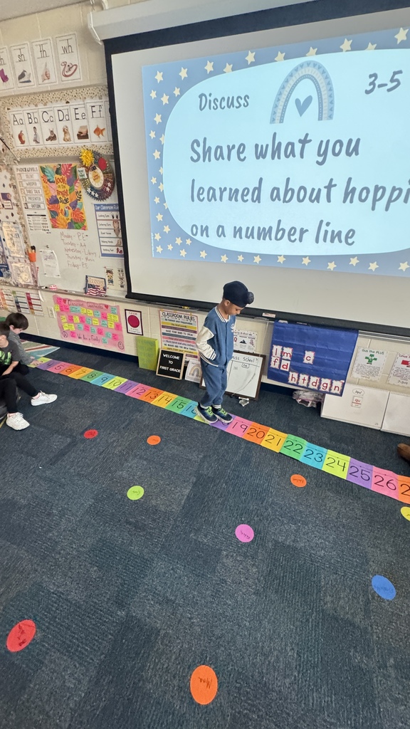 student jumping on number line
