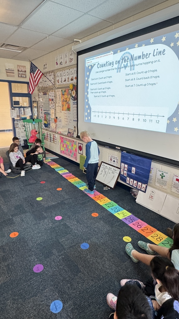 student jumping on number line